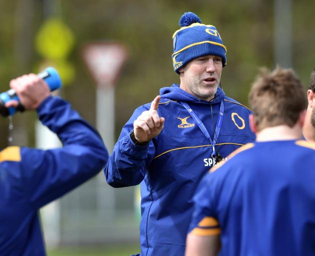 Coach Tom Donnelly talks to the Otago team at training at Logan Park. PHOTO: PETER MCINTOSH