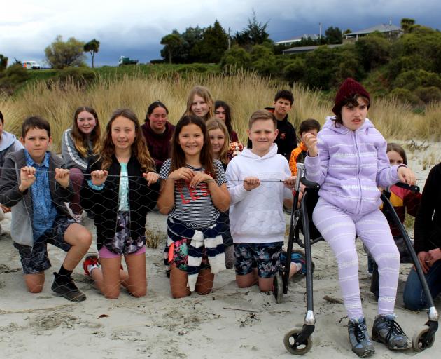 Okahau dune project organiser Angelina Young (far right) and Warrington School pupils were at...