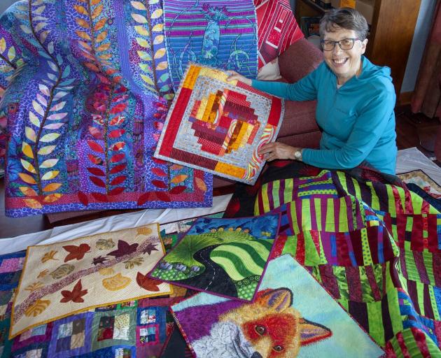 Christchurch Quilters president Maria Rohs with her ‘vivid’ themed quilt. Photo: Geoff Sloan