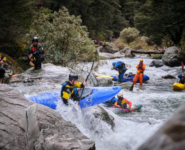 Kayaker Ewan Rodway at the top of a 2m drop on the Motatapu River. PHOTO: CAM KERR