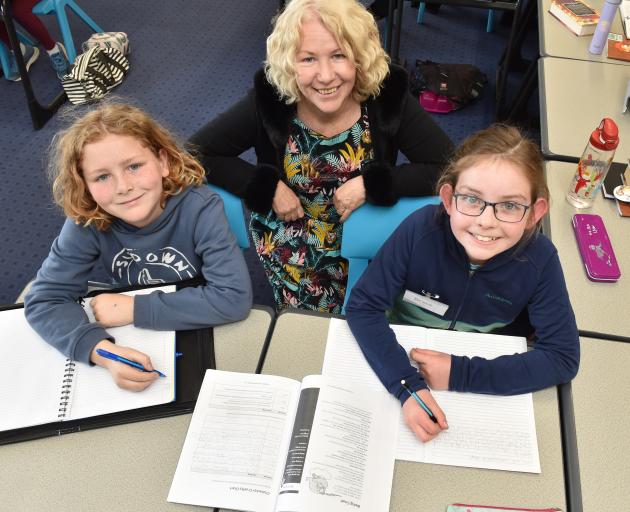 Working on their creative writing at the Write Like an Author workshop at Otago Girls’ High...