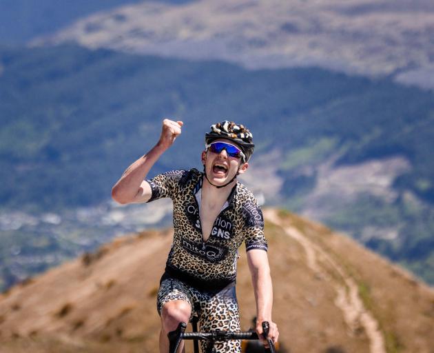Josh Burnett celebrates after winning stage four of the Tour of Southland at The Remarkables...