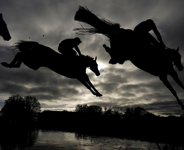 Runners clear the water jump at Wincanton Racecourse in England. PHOTO: GETTY IMAGES