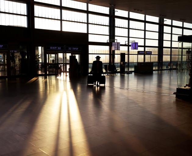 A passenger arrives at a terminal at Ben Gurion international airport in Lod, near Tel Aviv. File...