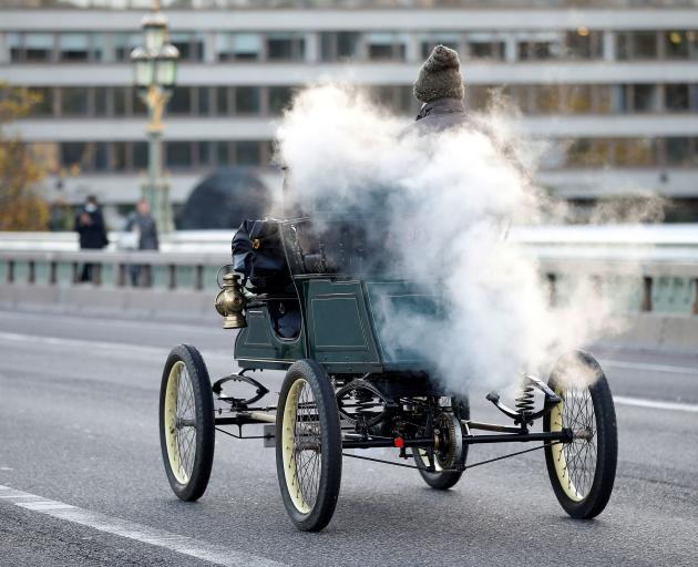 A competitor crosses Westminster Bridge in London during the London to Brighton veteran car run....