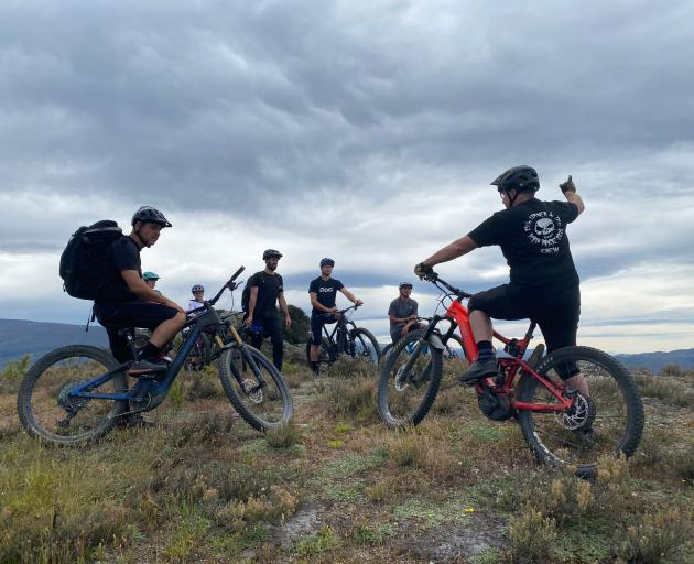 Local mountain biker Phil Oliver (right) shows Crankworx athletes and local riders around Matangi...