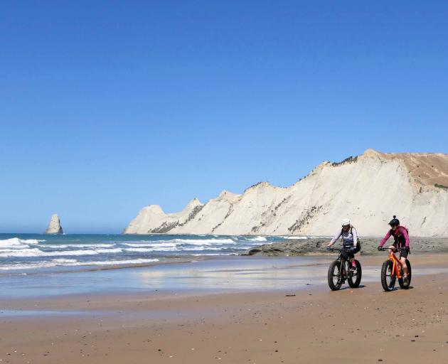 Cycling the sands at Cape Kidnappers with Hawke's Bay's Gannet Bikes. ...