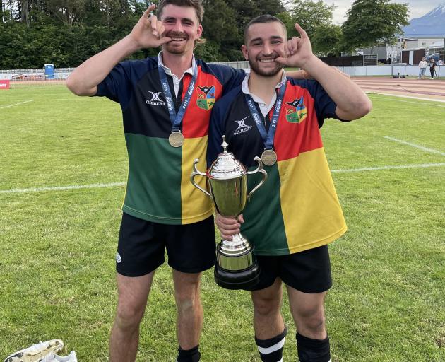 Carisbrook Bush Pigs winger Mackenzie Haugh (left) and captain Wilson Driver celebrate defeating...