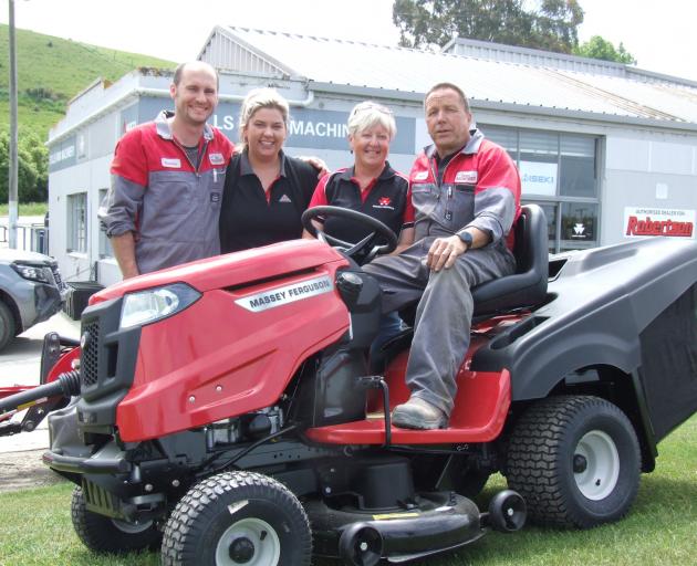 Hayden (left) and Kelly Currie and Raewyn and Kerry Still operate a farm machinery business on...