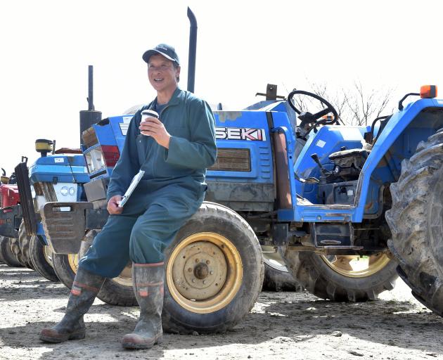 Retired Outram market gardener Graeme Young with his tractors that were recently auctioned. PHOTO...