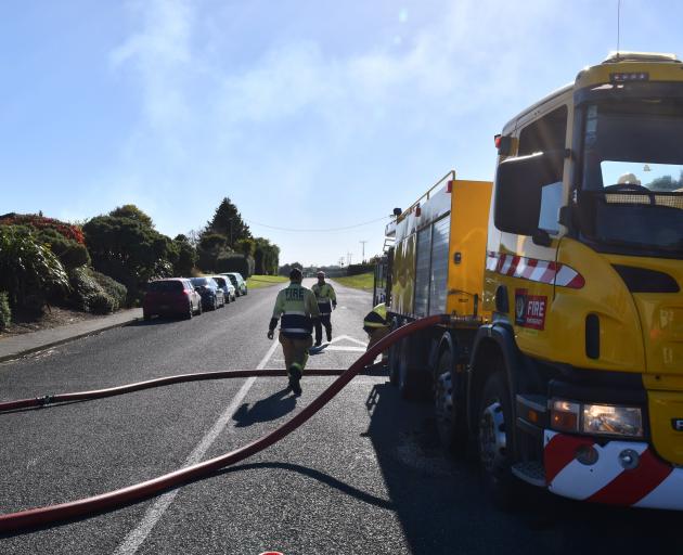 Firefighters at the scene this morning. Photo: Laura Smith