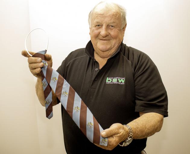 Trevor Bond with the Government-issue tie emblazoned with the New Zealand coat of arms used by...