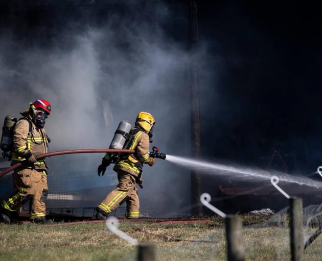 Firefighters battle the large blaze near Lincoln. Photo: George Heard / NZH