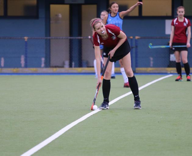 Lily Abbott prepares for a hockey game to start.