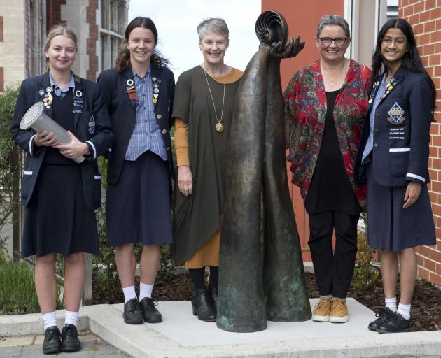Otago Girls’ High School staff and pupils (from left) prefect Jemma Tutty, holding a time capsule...
