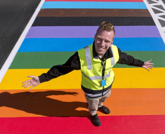 Dunedin Airport operations manager Jesse Gibbs welcomes all-comers on a new rainbow crossing...