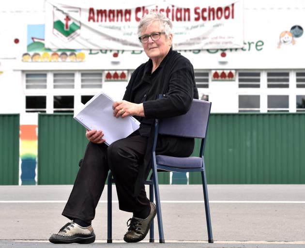 Sitting across the road from her school yesterday is Amana Christian School principal Roslyn King...