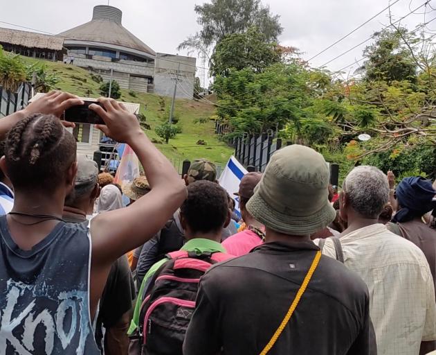 Protesters outside the parliament building in Honiara on Wednesday. Image: Georgina Kekea via...