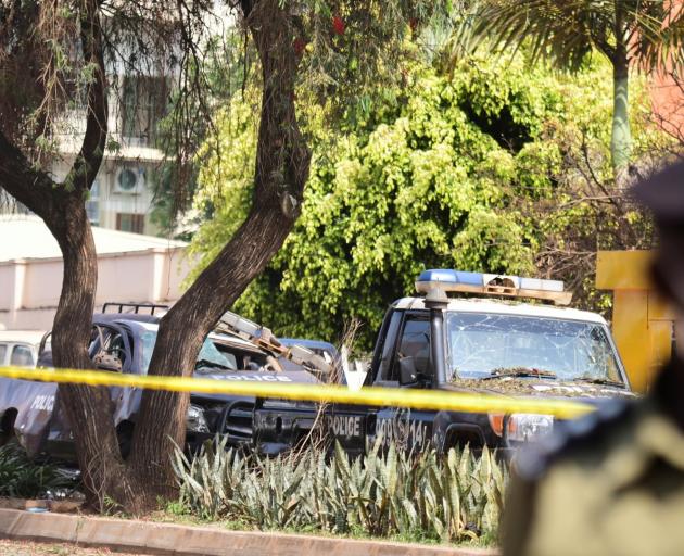 Wrecked police vehicles near the scene of the blast in Kampala. Photo: Reuters 