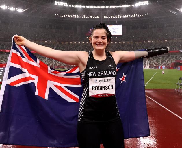 Otago Paralympian Holly Robinson celebrates winning gold in the women’s F46 javelin at the Tokyo...