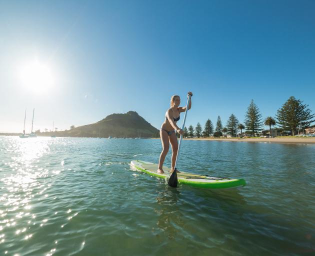 Enjoy a morning walk around the base of Mauao (Mount Maunganui) or go stand-up paddleboarding...