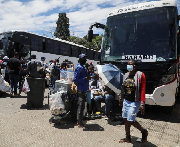 Passengers at a bus station in Johannesburg, South Africa. Photo: Reuters