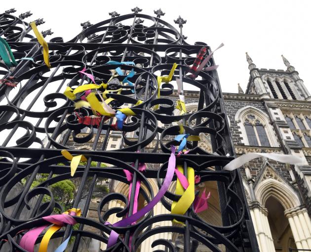 Ribbons symbolising solidarity with abuse survivors are tied to the gates of Dunedin’s St Joseph...