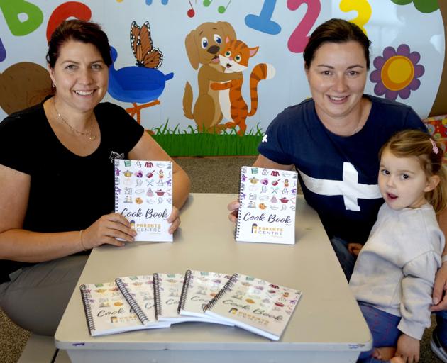 Ashburton Parents Centre cookbook authors Nicole Elliot (left) and Michelle Boleyn with daughter...