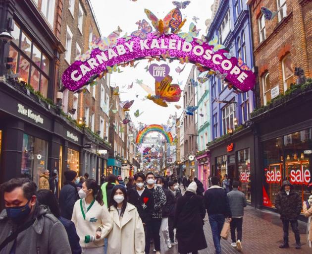 Shoppers in London's busy Carnaby Street take advantage of the Boxing Day sales. Photo: Getty...