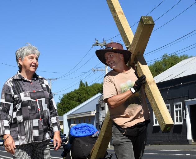 Paul Atkinson takes a moment to speak to Dunedin resident Janice Bridgman as he sets off on his...