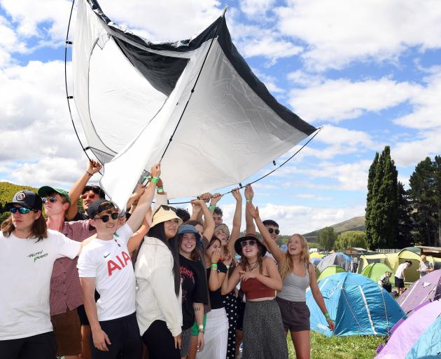 University students from Otago and Canterbury get ready to pitch a tent at the Rhythm & Alps...