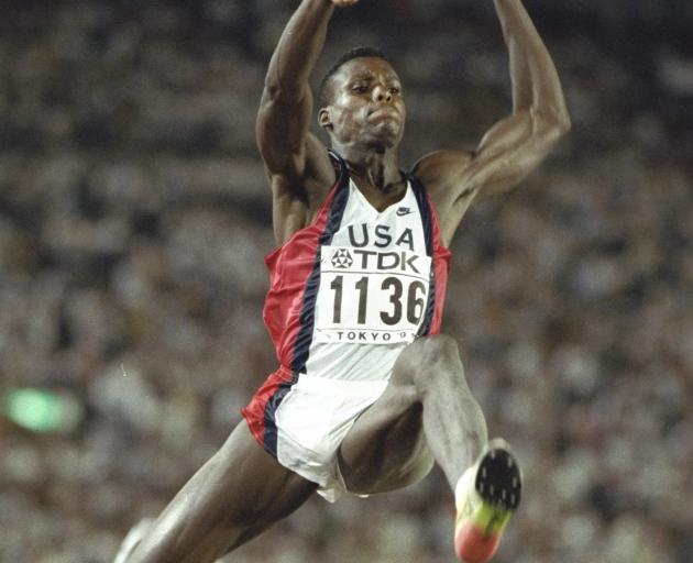 Carl Lewis, of the United States, leaps during the long jump final at the 1991 World Athletics...