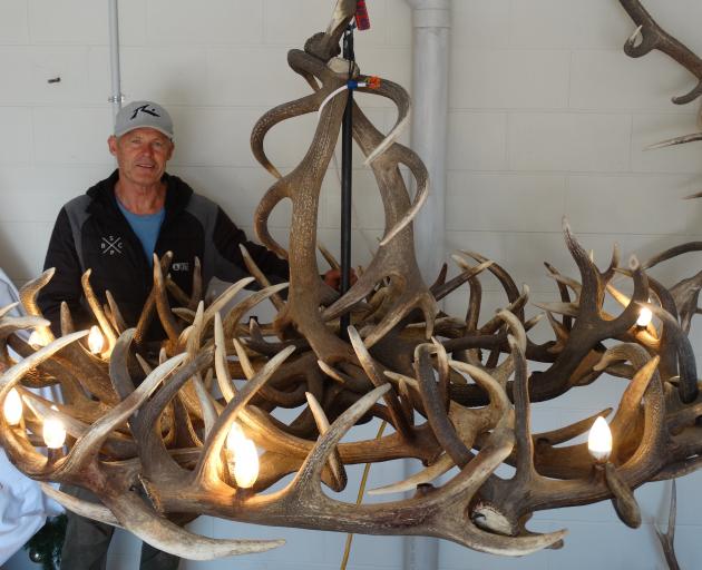 Jeff Hylton and a partly completed chandelier. PHOTO: GUY WILLIAMS