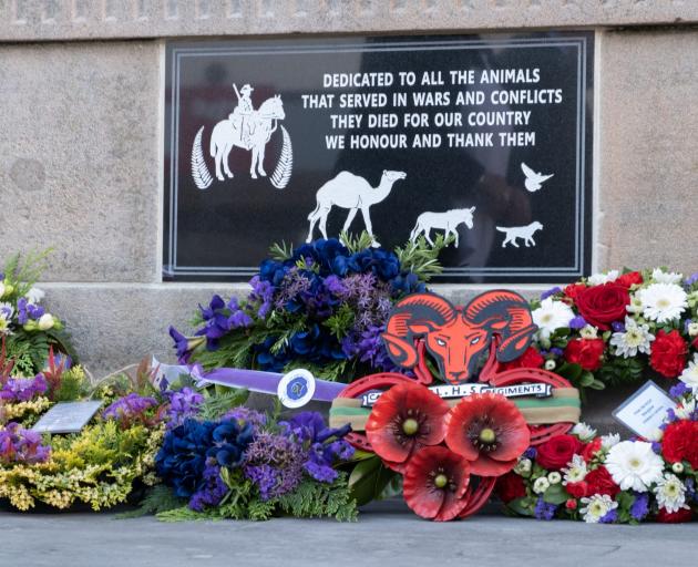 Wreaths laid at the foot of a plaque honouring the wartime service of animals. The plaque was...