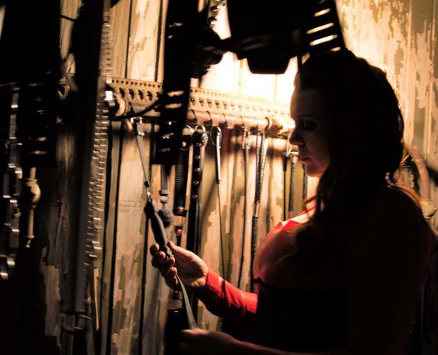 Dominatrix 'Red Fox' in her garage at an undisclosed South Island location. Photo: Red Fox