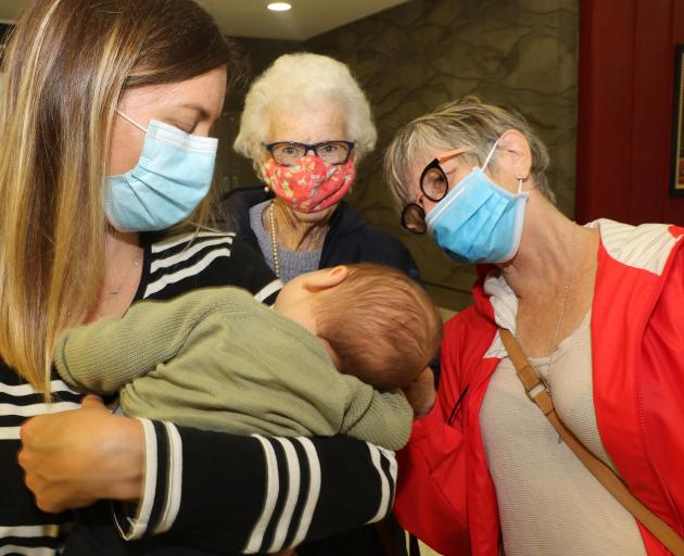 Lucy Edwards introduces nine-week-old baby Leo to grandmother Julie and great grandmother Shirley...