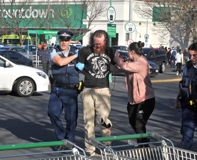 Off-duty police, members of the public and Countdown staff restrained Luke Lambert after he...