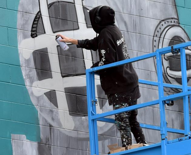 The Taranaki artist known professionally as Milarky puts the final touches on the large-scale...