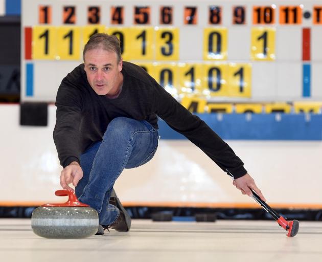 Demonstrating curling at the Dunedin Ice Stadium is Murray Pitts. PHOTO: STEPHEN JAQUIERY