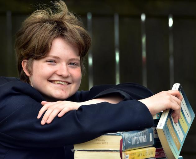Leaning on a selection of library books yesterday is Otago Girls’ High School pupil Lauren...