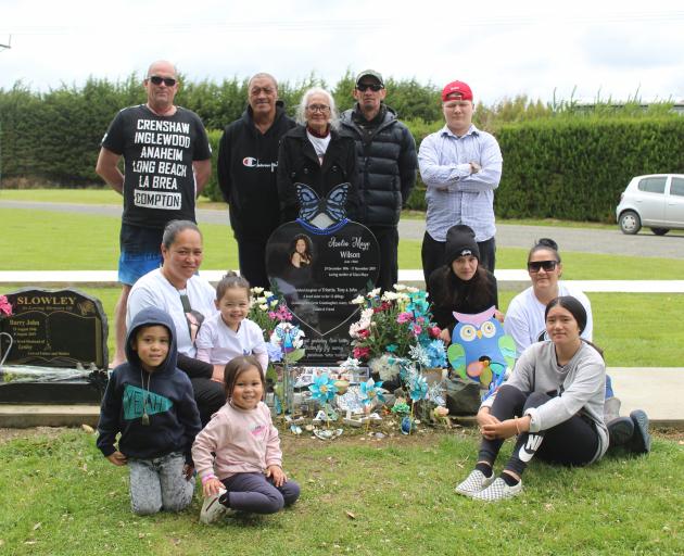 Members of Azalia Wilson’s family visit her grave to commemorate her life yesterday. PHOTO: VALU...