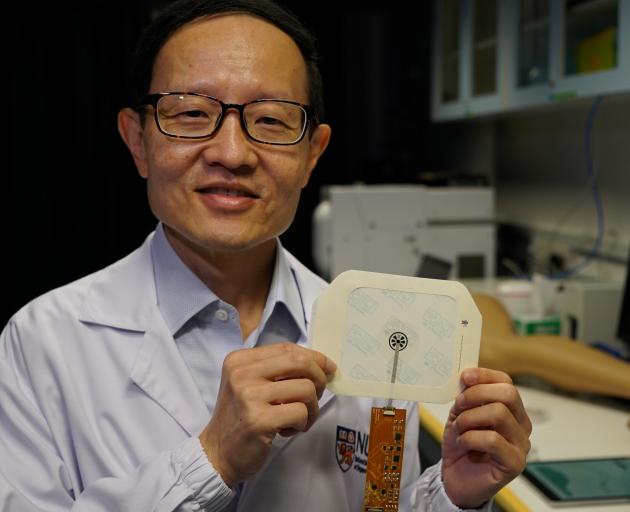 Professor Chwee Teck Lim with a VeCare bandage which will allow patients to convalesce more at...
