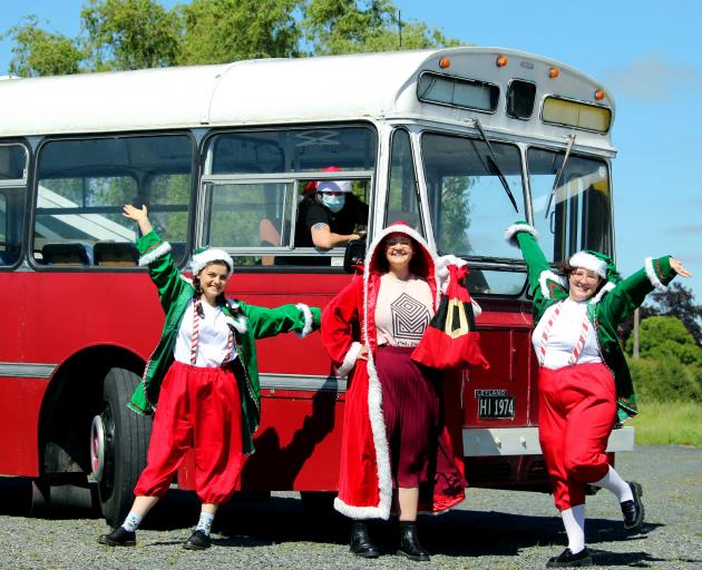 Otago Heritage Bus Society volunteer driver Dawn McFarlane and Otago Museum staff (from left)...