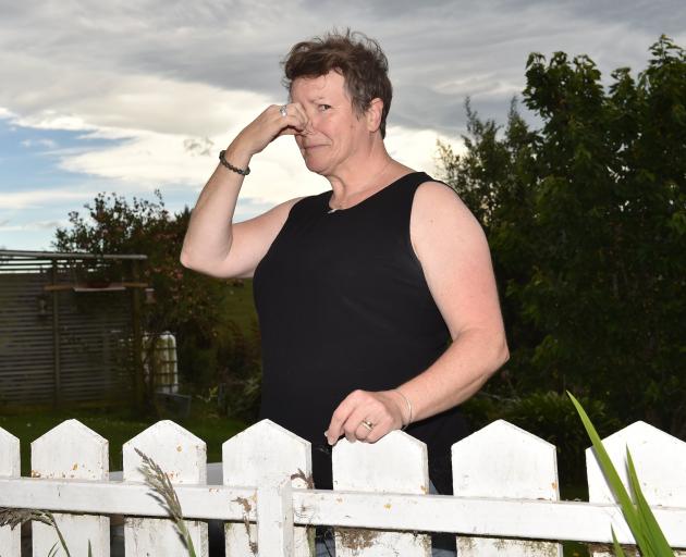 Dunedin woman Tina Tunster is fed up with the stench wafting over her property from the nearby...