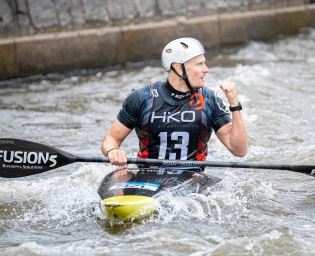 Finn Butcher celebrates his outstanding performance in the canoe slalom ranking event in the...