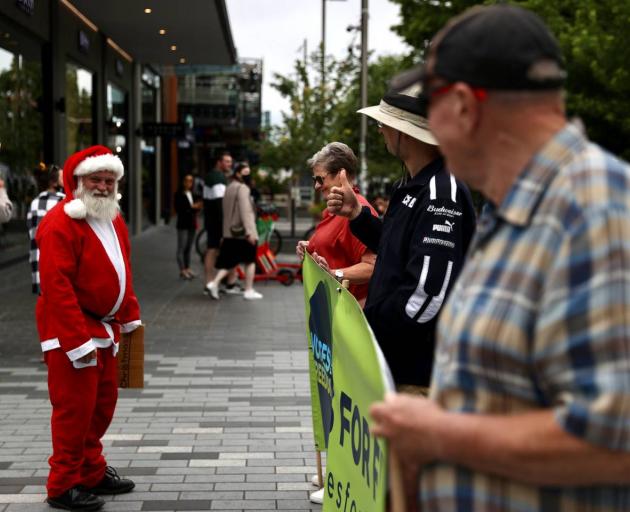Families, businessmen, teenagers, retirees and Santa were among the protesters. Photo: George Heard