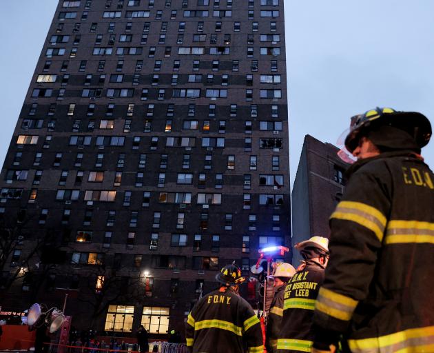 Emergency personnel from the New York City Fire Department (FDNY) respond to an apartment building fire in the Bronx borough of New York City. Photo: Reuters