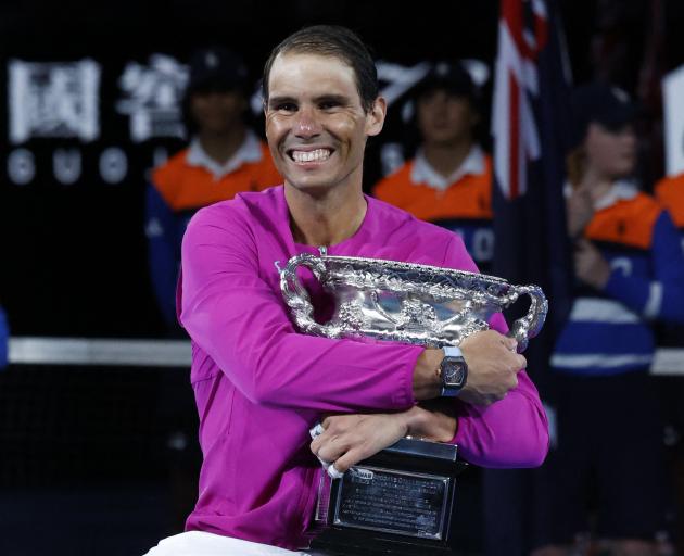Rafael Nadal celebrates winning his 21st Grand Slam early on Monday in Melbourne. Photo: Reuters 