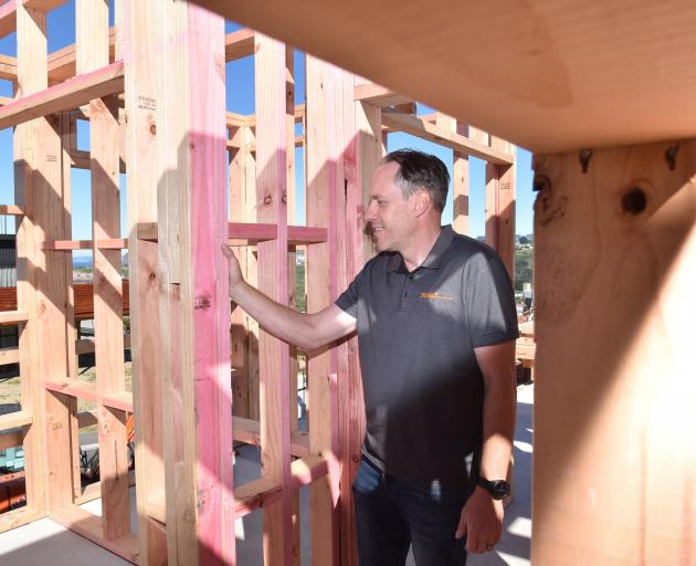 Stewart Construction contract manager Jodie Peters checks progress on a new build in Ocean Grove...