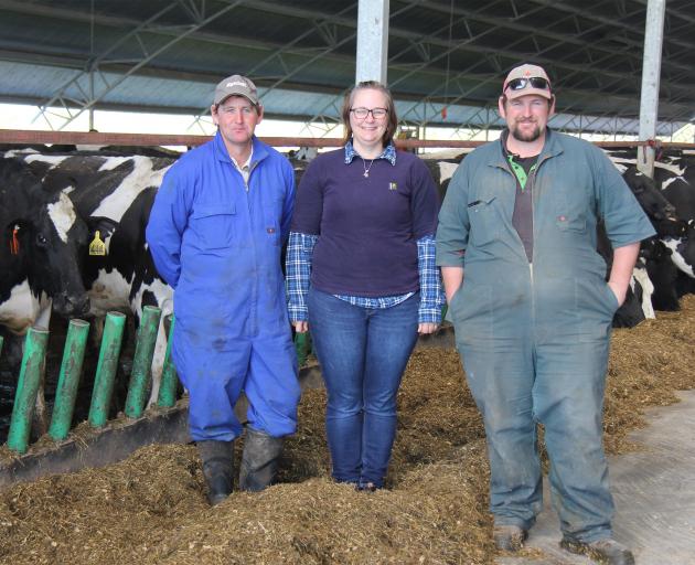 Stewart family trio Mark, Stacey and TJ in their free-stall barn, which is allowing them to...